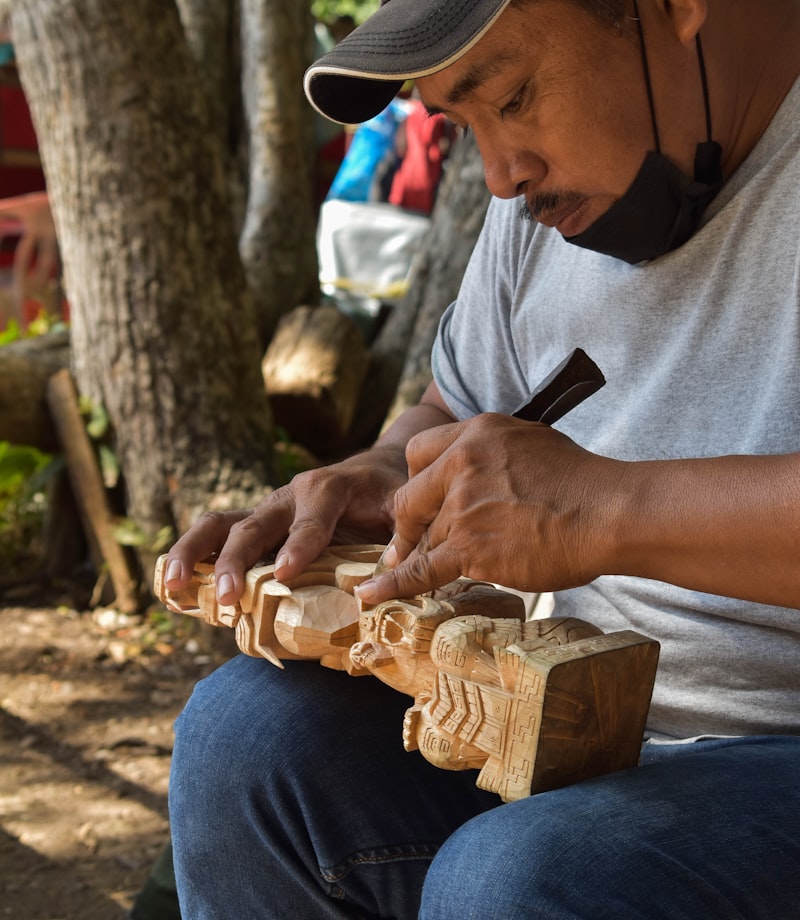 Joss carving a spoon blank with a knife